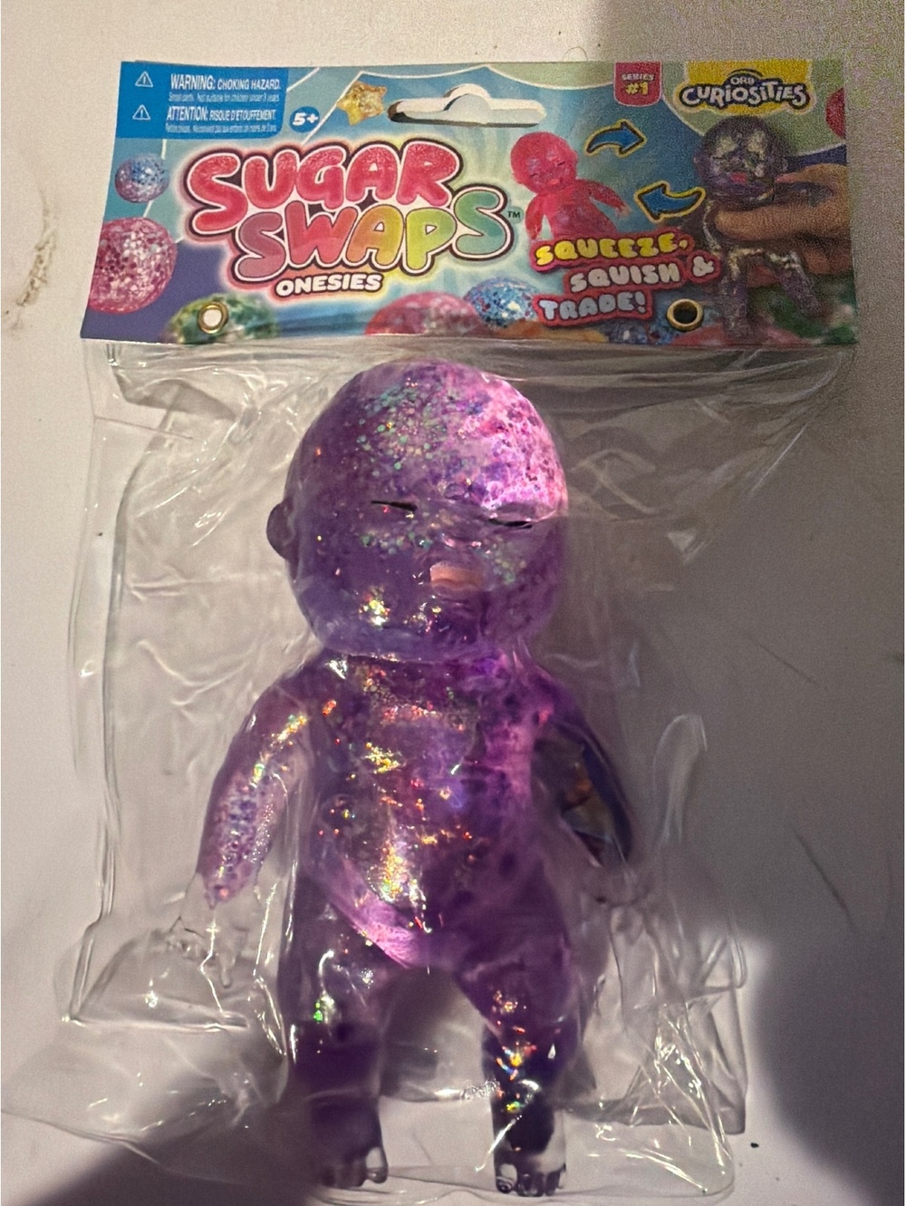 Sugar Swaps Onesies Squeeze Squish & Trade Purple Glitter Figure